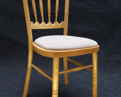Natural wood banquet chair with ivory cushion