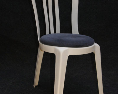 White dining chair with blue cushion