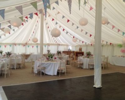 Interior of traditional style marquee with bunting