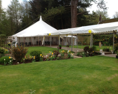 Marquee with covered walkway to house