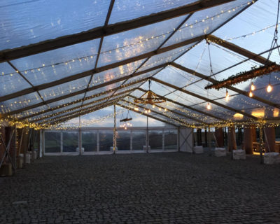 statement lighting in glass roofed marquee