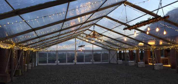 statement lighting in glass roofed marquee